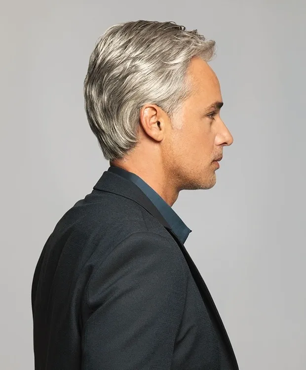 A man in a suit with grey hair.