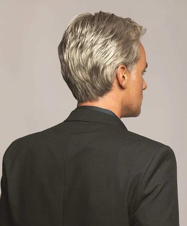 The back view of a man in a suit.