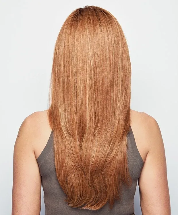 The back view of a woman with long red hair.