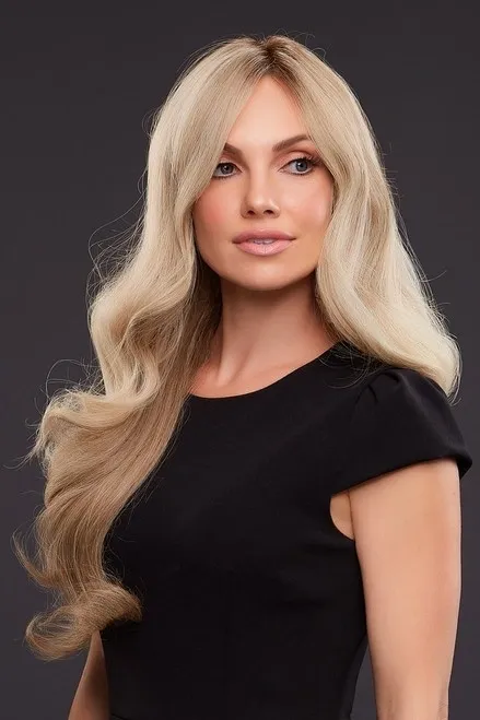 A woman in a black dress with long blonde hair.
